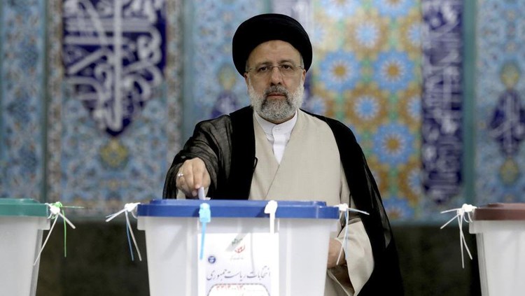 Ebrahim Raisi, a candidate in Iran's presidential elections, casts his vote at a polling station in Tehran, Iran Friday, June 18, 2021. Iran began voting Friday in a presidential election tipped in the favor of a hard-line protege of Supreme Leader Ayatollah Ali Khamenei, fueling public apathy and sparking calls for a boycott in the Islamic Republic. (AP Photo/Ebrahim Noroozi)