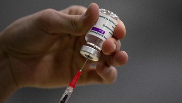 FILE - In this  Friday, Feb. 19, 2021 file photo, a pharmacist prepares a syringe from a vial of the AstraZeneca coronavirus vaccine during preparations at the Vaccine Village in Antwerp, Belgium. A shipment of a quarter million AstraZeneca vaccines destined for Australia has been barred from leaving the European Union in the first use of an export control system instituted by the bloc over a month ago. An EU official, who asked not to be identified because of the sensitivity of the issue, confirmed a report that first appeared in the Financial Times. (AP Photo/Virginia Mayo, File)