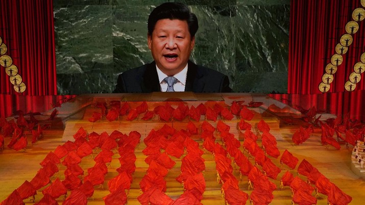 100 tahun Partai Komunis China Chinese President Xi Jinping is displayed on a screen as performers dance at a gala show ahead of the 100th anniversary of the founding of the Chinese Communist Party in Beijing on Monday, June 28, 2021. China is marking the centenary of its ruling Communist Party this week by heralding what it says is its growing influence abroad, along with success in battling corruption at home. Party officials on Monday heaped praise on President Xi Jinping, who has established himself as China's most powerful leader since Mao Zedong, and has eliminated any limits on his term in office. (AP Photo/Ng Han Guan)
