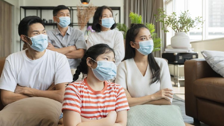 strong healthy asian family wearing surgical protective face mask stay quarantane together at home social distacing new normal lifestyle