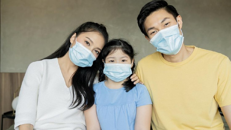 strong healthy asian family wearing surgical protective face mask stay quarantane together at home social distacing new normal lifestyle