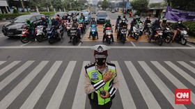 FOTO: Hening Cipta Bagi Korban Covid-19 di Indonesia