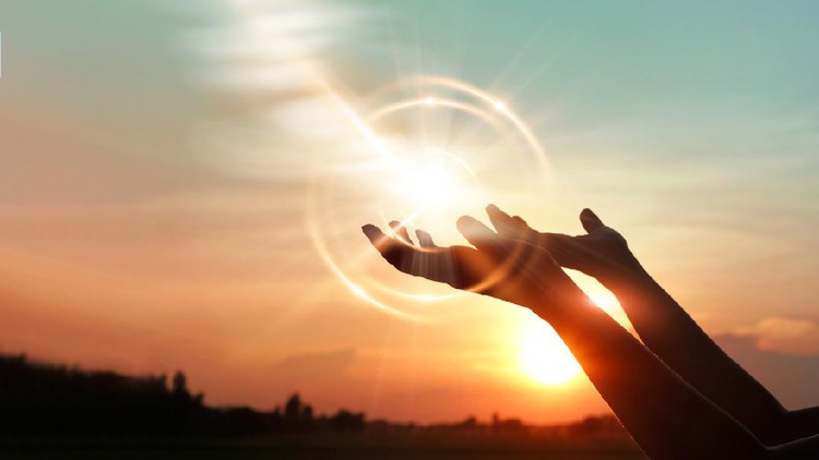 Woman hands praying for blessing from god on sunset background