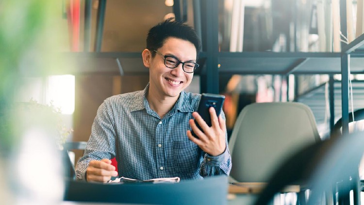 smart confidence asian startup entrepreneur business owner businessman smile hand use smartphone woking in office background