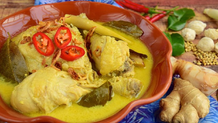 Indonesian food Opor Ayam, chicken cooked in coconut milk and spices. Served to celebrate Idul Fitri / Lebaran
