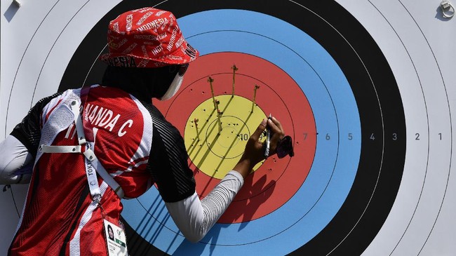 Tim panahan beregu Indonesia lolos ke babak 16 besar Olimpiade Tokyo 2020 berkat hasil round ranking di Yumenoshima Park, Tokyo.