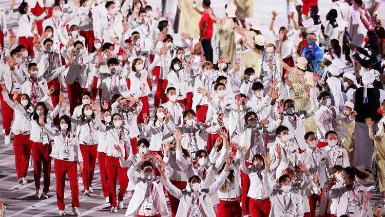 TOKYO, JAPAN - JULY 23: Athletes of Team Japan wave during the Opening Ceremony of the Tokyo 2020 Olympic Games at Olympic Stadium on July 23, 2021 in Tokyo, Japan. (Photo by Patrick Smith/Getty Images)