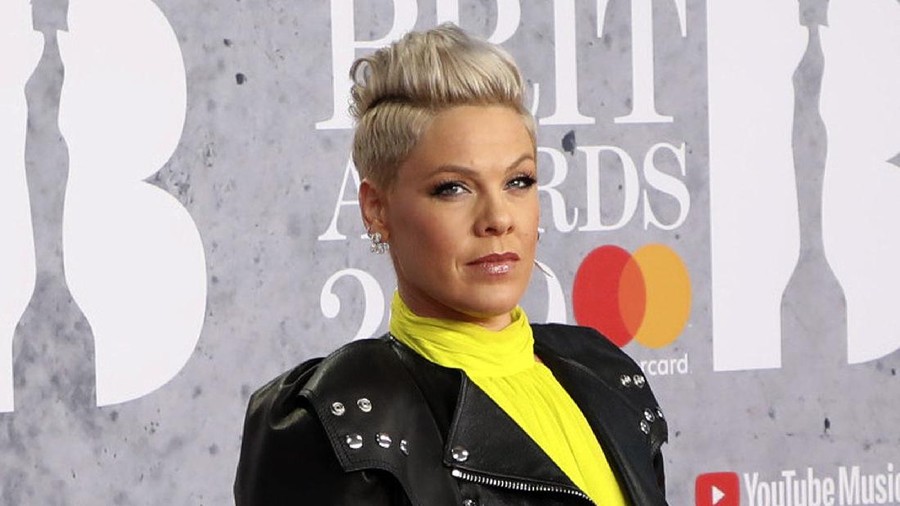Norway Beach Handball Clothing Pink FILE - In Wednesday, Feb. 20, 2019 file photo, singer Pink poses for photographers upon arrival at the Brit Awards in London. U.S. pop singer Pink has offered to pay a fine given to the Norwegian female beach handball team for wearing shorts instead of the required bikini bottoms. Pink said she was “very proud” of the team for protesting against the rule that prevented them from wearing shorts like their male counterparts. At the European Beach Handball Championships in Bulgaria last week, Norway’s female team was fined 1,500 euros ($1,770) for what the European federation called improper clothing and “a breach of clothing regulations.” (Photo by Vianney Le Caer/Invision/AP, File)