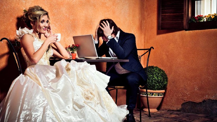Beautiful bride drinking coffee and groom in shock seeing how much money he has spent for the wedding. Initial Rating 5! Thak you, iStock :-)