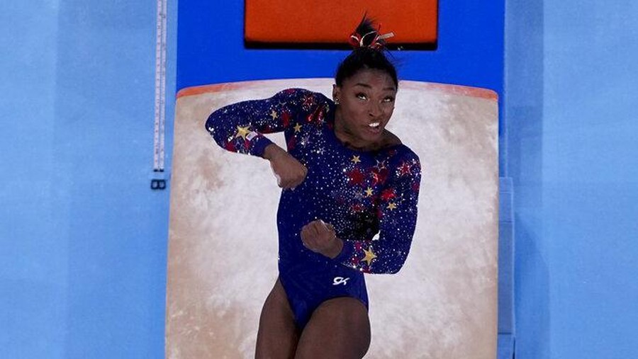 Simone Biles, of United States, performs on the vault during women's artistic gymnastic qualifications at the 2020 Summer Olympics, Sunday, July 25, 2021, in Tokyo. (AP Photo/Morry Gash)