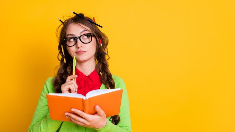 Close-up portrait of attractive minded brainy genius girl writing essay creating solution isolated over bright yellow color background.