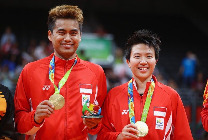 RIO DE JANEIRO, BRAZIL - AUGUST 17:  Gold medalists, Tontowi Ahmad and Liliyana Natsir of Indonesia celebrate after the Mixed Doubles Gold Medal Match on Day 12 of the Rio 2016 Olympic Games at Riocentro - Pavilion 4 on August 17, 2016 in Rio de Janeiro, Brazil.  (Photo by Dean Mouhtaropoulos/Getty Images)