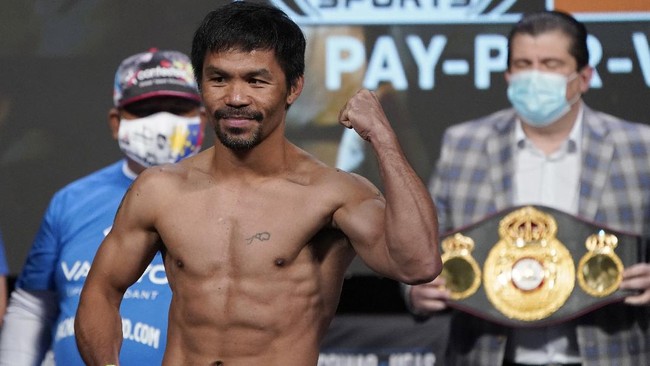 Duel Manny Pacquiao vs Yordenis Ugas resmi akan berlangsung Minggu (22/8) siang WIB setelah kedua petinju lolos timbang badan.