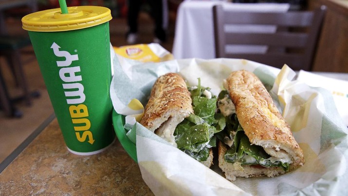 Subway Loyalty Program Changes The Subway logo is seen on on a soft drink cup next to a sandwich at a restaurant in Londonderry, N.H., Friday, Feb. 23, 2018. Subway is shaking up its loyalty rewards program, giving customers the ability to earn $2 discounts instead of free Footlongs.
(AP Photo/Charles Krupa)