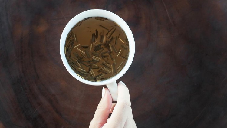 Cup of ginger lemongrass tea on the wooden table