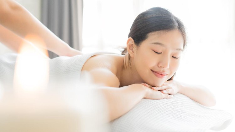 Young Asian woman  in spa salon getting massage.