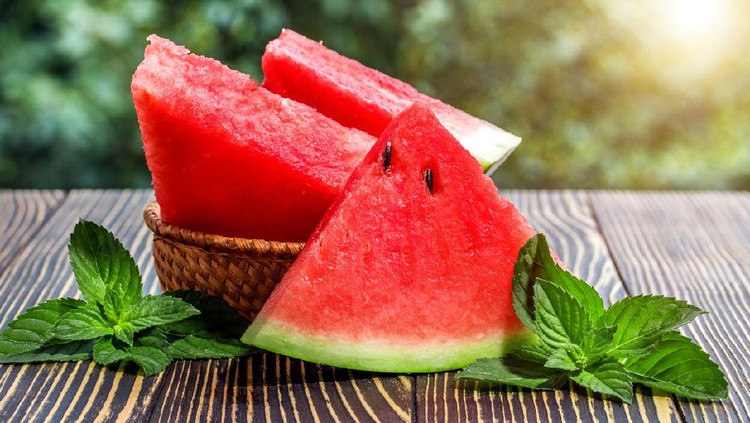 Buah Semangka Fresh sliced watermelon wooden old background