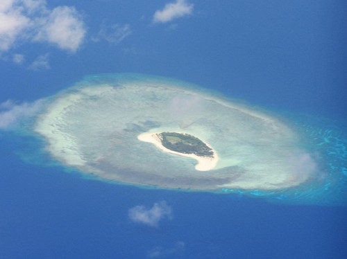 This photo taken on April 21, 2017 shows an aerial shot of a reef in the disputed Spratly islands on April 21, 2017. - Philippine Defence Secretary Delfin Lorenzana flew to a disputed South China Sea island on April 21, brushing off a challenge by th