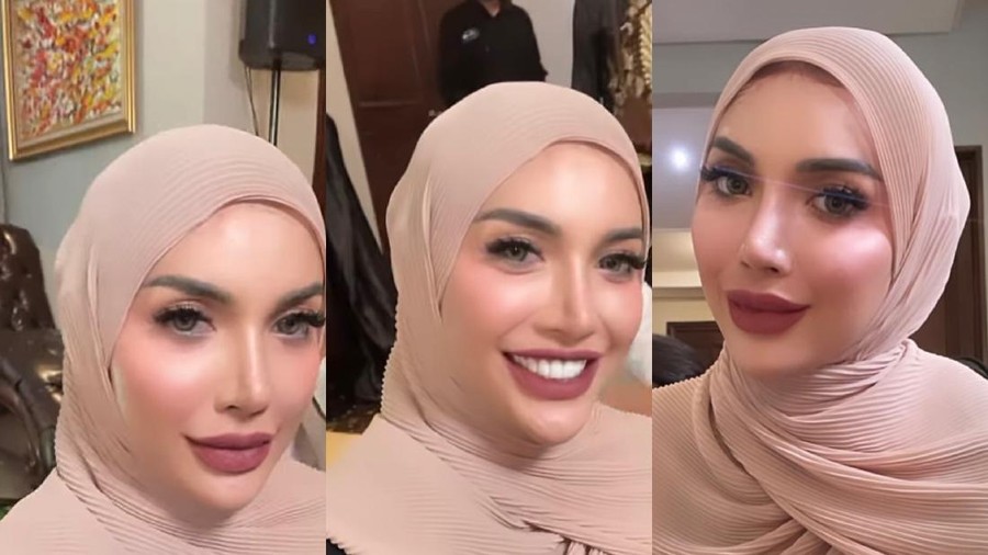 Gaya Millen Cyrus yang memakai hijab.