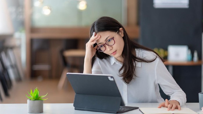 depressed Asian woman in deep many thoughts, having problem with over thinking
