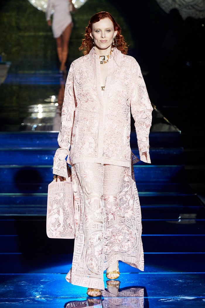 A supermodel known for her red hair, Karen Elson looks elegant in a lace shirt and skirt. Photo: Daniele Schiavello / Gorunway.com