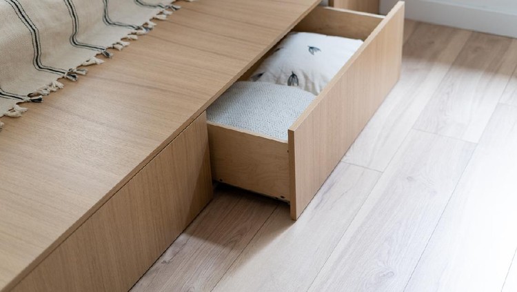Bedroom interior, wooden bed at modern room. Furniture design with open wood drawer, white pillow decoration object in box. Brown comfortable storage for bedding cushion.