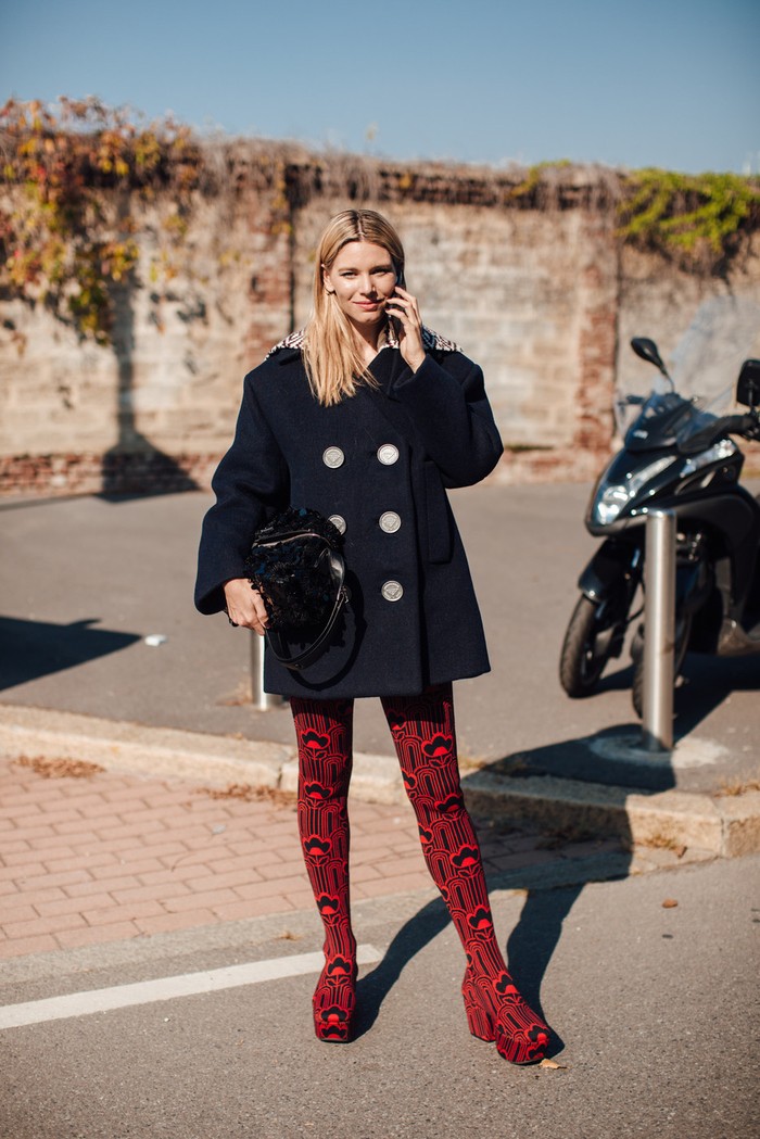The surprise came from the classic oversized coat when worn with graphic print socks boots in red. Photo: livingly.com/IMAXtree