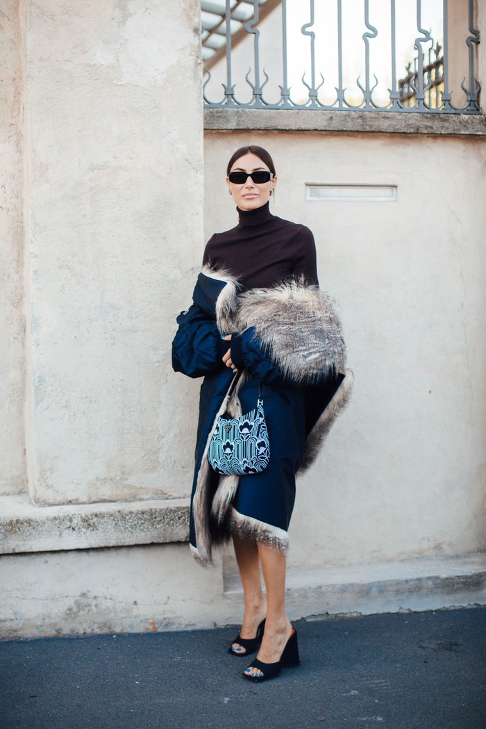 The faux-fur coat and hobo bag from the Prada collection are two of the favorite items for street style stars at Milan Fashion week. Photo: livingly.com/IMAXtree