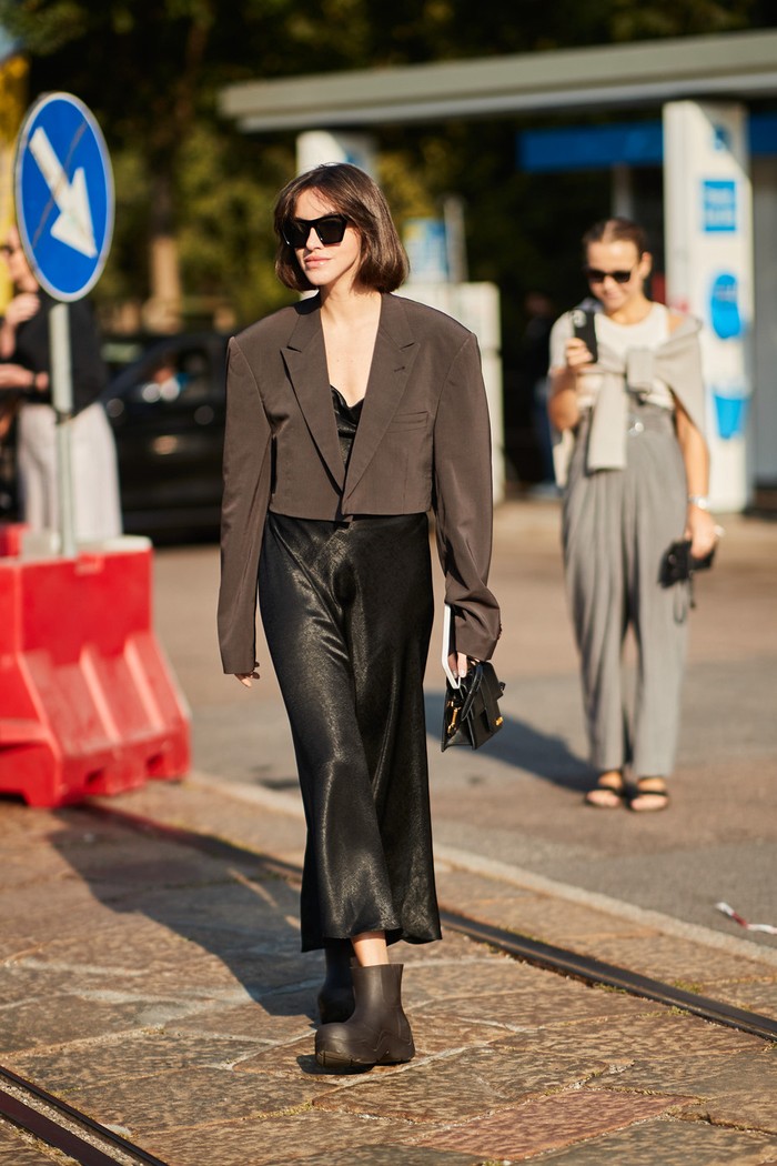 Slip dresses don't always have to be worn with heels, try pairing them with rain boots and cropped jackets for a more modern style. Photo: livingly.com/IMAXtree