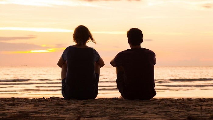 Photo of romatic couple hands, walking outdoor and spending time together