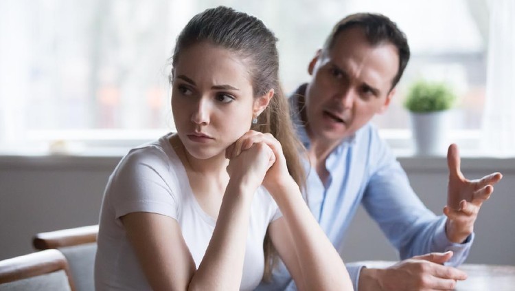 1063676618 Offended woman sitting back to lover looking away avoiding talking, millennial couple having serious fight, mad man screaming or lecturing wife, stubborn female not ready to compromise or reconcile