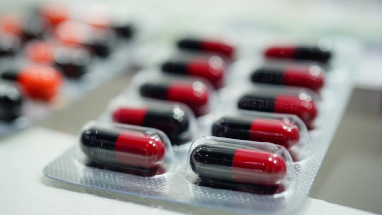 Close-up red and black Medicine Capsules in Blister Packs