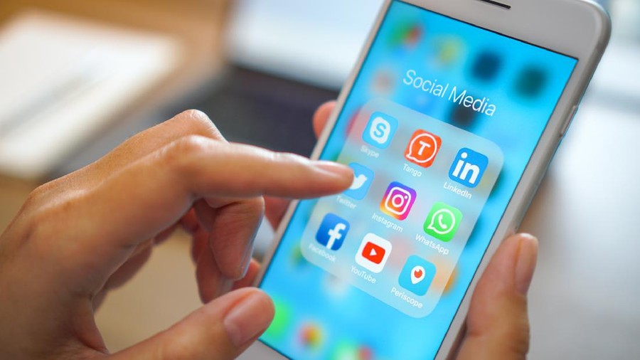 Bangkok, Thailand - JUN 18, 2018: social medial app iPhone mobile phone with blue screen background technology business smartphone digital communication facebook and internet editorial
