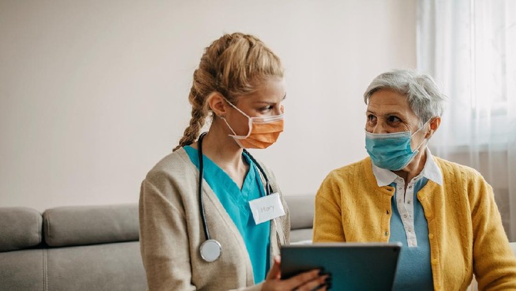 Senior woman visited by home care specialist