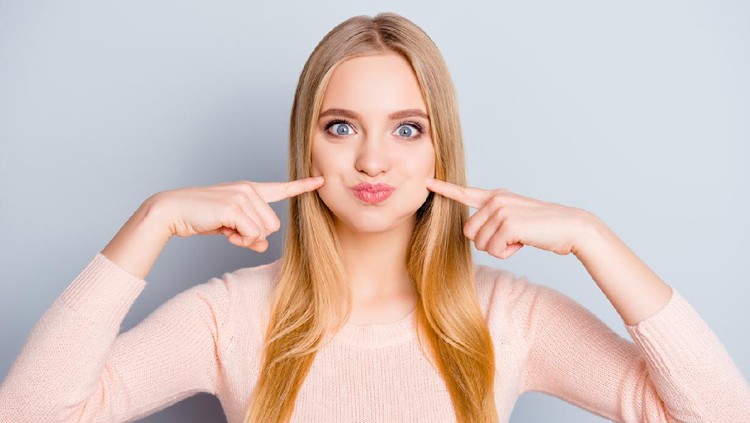 Ilustrasi Wajah Bulat People person comedian humor joke concept. Portrait of grimacing attractive cute sweet lovely adorable restless carefree with long hairstyle girl holding air in cheeks isolated on gray background