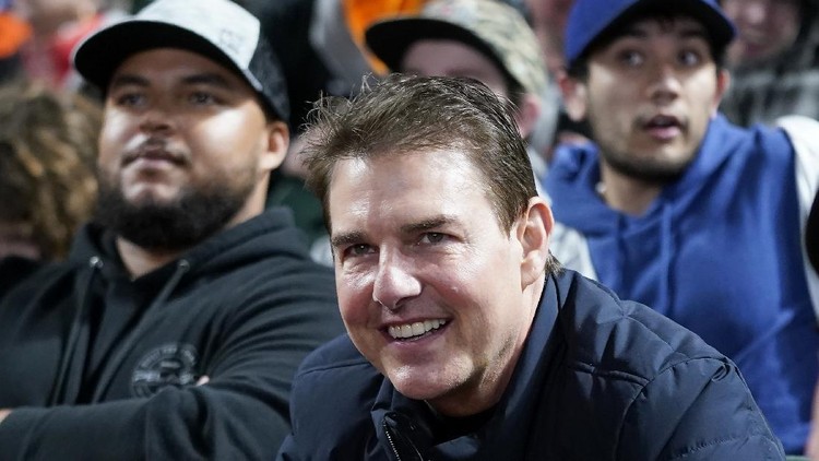 Actor Tom Cruise smiles during Game 2 of a baseball National League Division Series between the San Francisco Giants and the Los Angeles Dodgers Saturday, Oct. 9, 2021, in San Francisco. (AP Photo/Jeff Chiu)