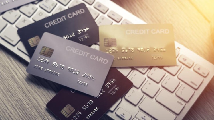 1253222991 many mockup credit card above white tablet keyboard on an office wooden table top view