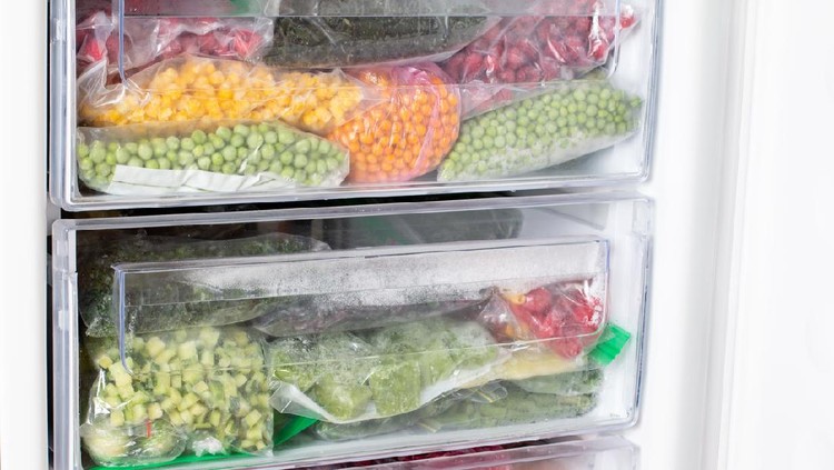 Frozen food in the freezer. Frozen vegetables, ready meals in the freezer. Frozen meat, food and vegetables. Food storage