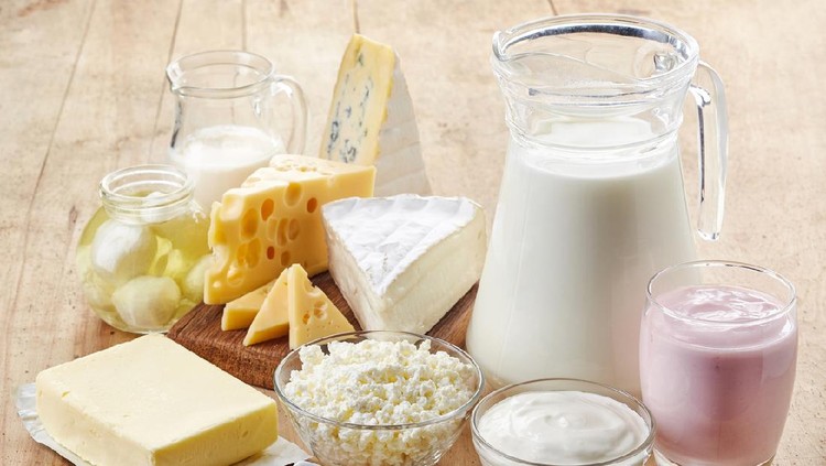 Various fresh dairy products on wooden background