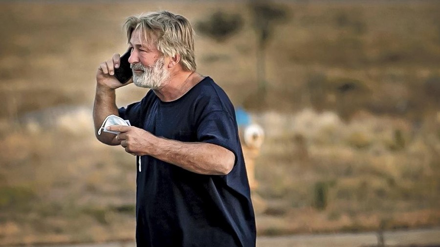 Alec Baldwin speaks on the phone in the parking lot outside the Santa Fe County Sheriff's Office in Santa Fe, N.M., after he was questioned about a shooting on the set of the film 
