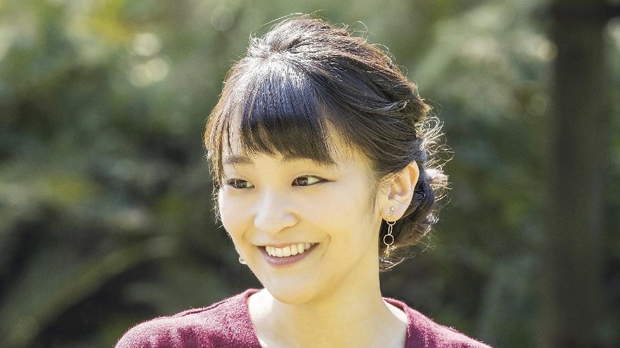 In this photo provided Saturday, Oct, 23, 2021, by the Imperial Household Agency of Japan, Japan's Princess Mako, left, the eldest daughter of Crown Prince Akishino and Crown Princess Kiko, strolls with her younger sister Princess Kako, at the garden of their Akasaka imperial property residence in Tokyo, Japan on Oct. 6, 2021, ahead of her 30th birthday on Oct. 23, 2021 and her marriage on Oct. 26, 2021.(The Imperial Household Agency of Japan via AP)