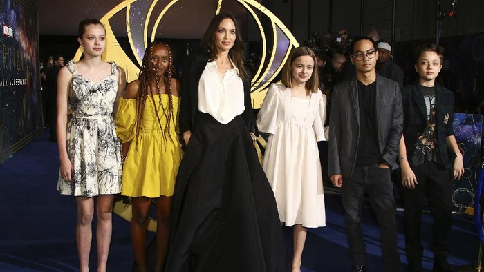 Angelina Jolie, third from left, poses with her children Shiloh Jolie-Pitt, from left, Zahara Jolie-Pitt, Vivienne Jolie-Pitt, Maddox Jolie-Pitt and Knox Jolie-Pitt upon arrival at the premiere of the film 'Eternals' on Wednesday, Oct. 27, 2021, in London. (Photo by Joel C Ryan/Invision/AP)