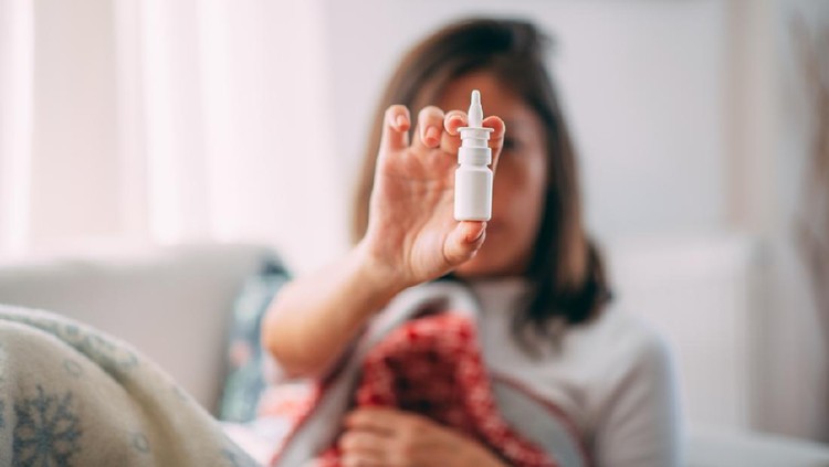 Sick Woman Holding Nasal Spray