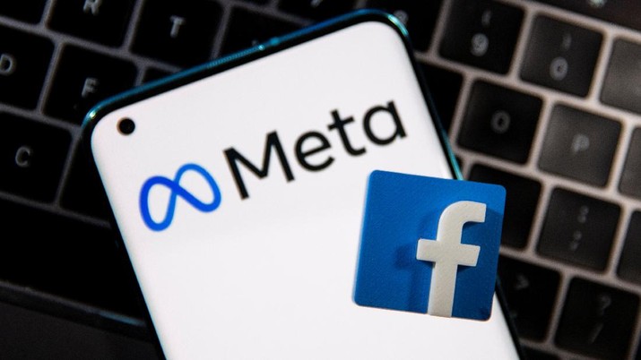 Meta A smartphone with Meta logo and a 3D printed Facebook logo is placed on a laptop keyboard in this illustration taken, October 28, 2021. REUTERS/Dado Ruvic/Illustration