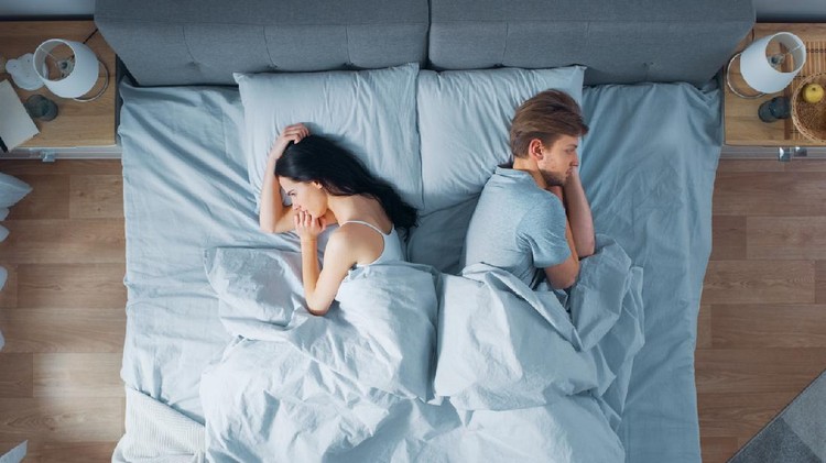 Quarrelling Young Couple in the Bed, Young People Lying Turned Away From Each other and Lay on Their Sides Holding Grudges and Being Offended