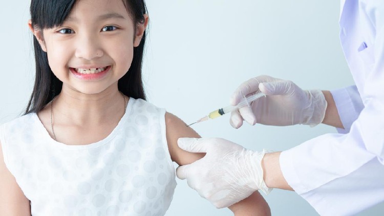 Little girl receiving coronavirus vaccine at doctor's office