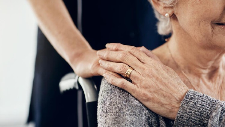Cropped shot of a female caregiver comforting a senior woman