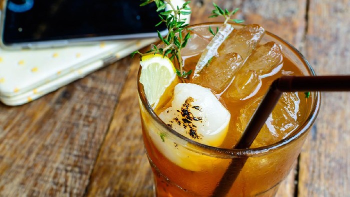 Lychee tea and thyme on wooden table