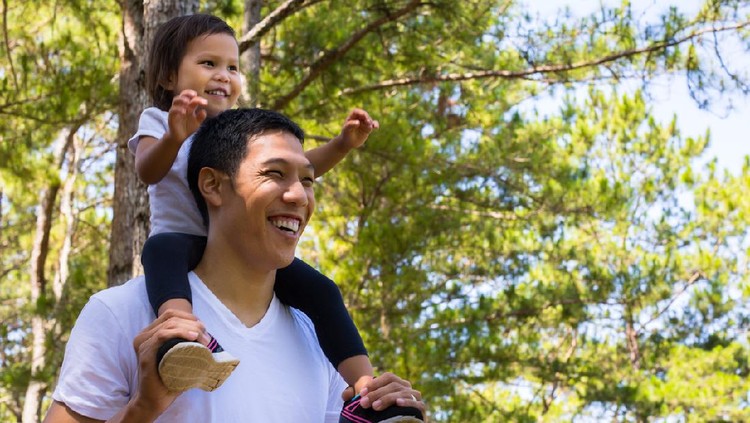 Family bonding during a walk through a park in Dalat.