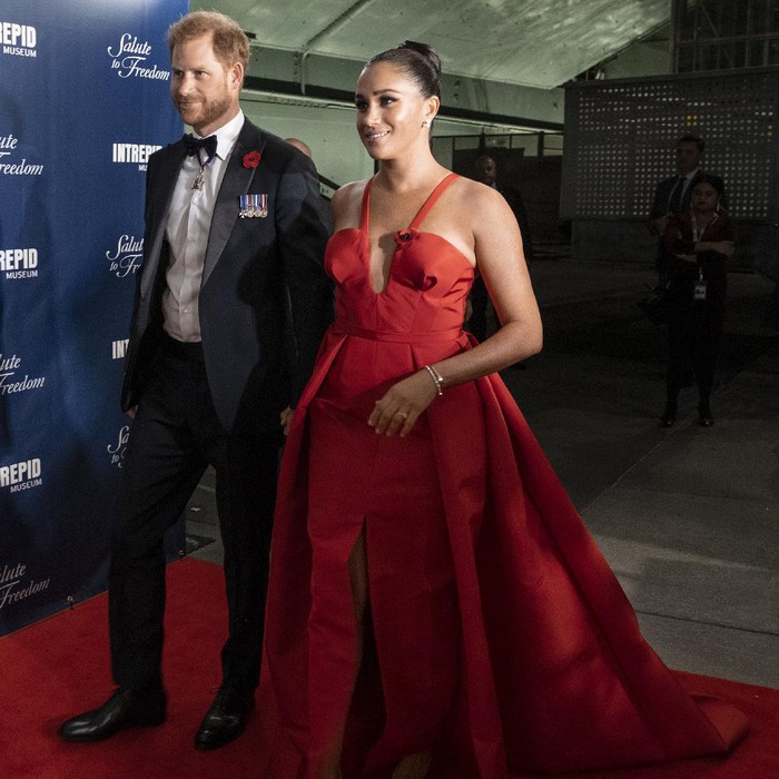 Prince Harry and Meghan Markle, Duke and Duchess of Sussex, greet Stephen Rudinski, right, a Valor Award recipient, and others, as they arrive at the Intrepid Sea, Air & Space Museum for the Salute to Freedom Gala Wednesday, Nov. 10, 2021, in New York. The Duke of Sussex will also present the inaugural Intrepid Valor Award to five service members, veterans and their military families. Valor Award recipients Barbara Block, center left, and Master Sgt. Kyle Hines, center right, look on.  (AP Photo/Craig Ruttle)